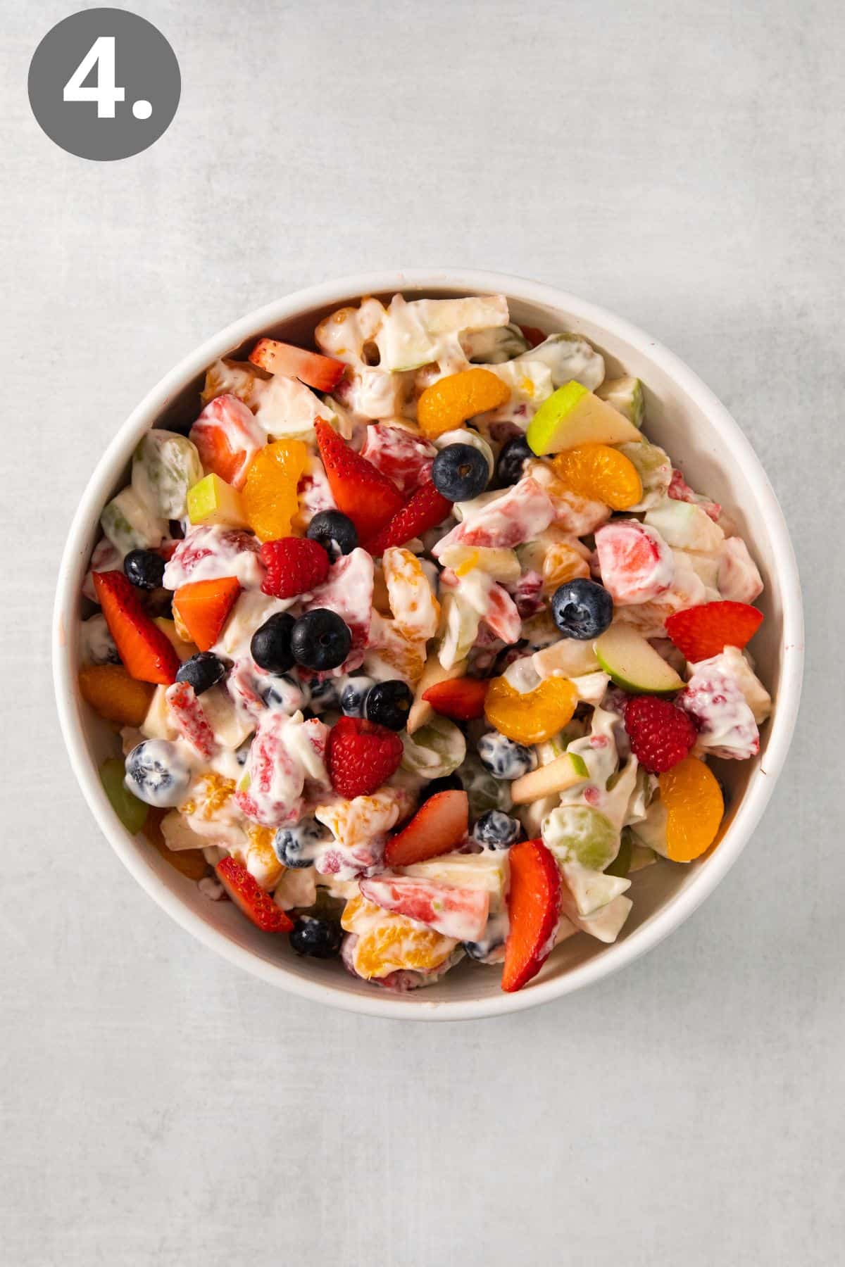 Easter fruit salad in a bowl with honey mascarpone mixed in