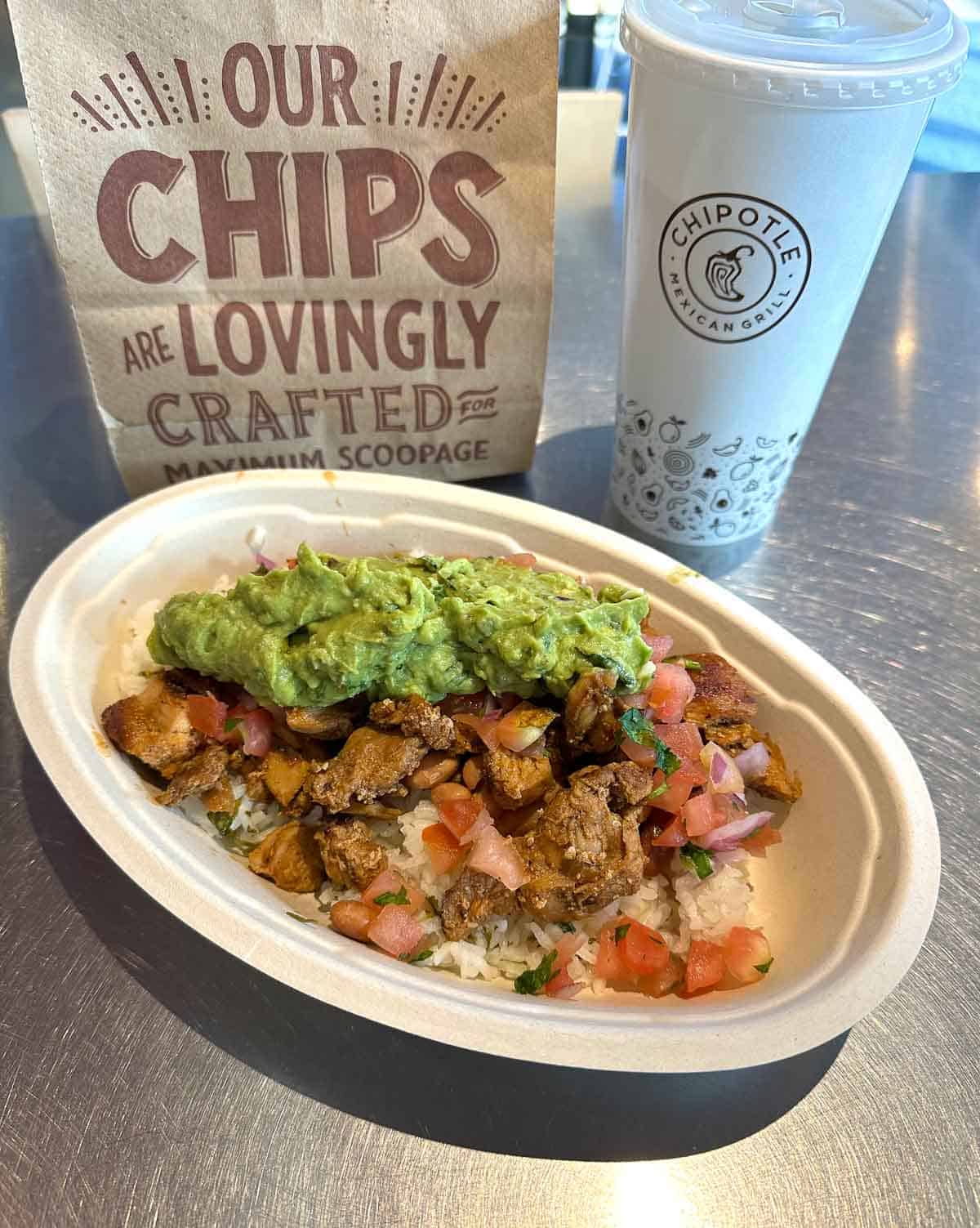gluten free burrito bowl topped with guacamole from chipotle