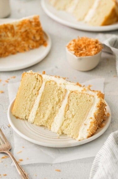 A slice of coconut cake on a plate