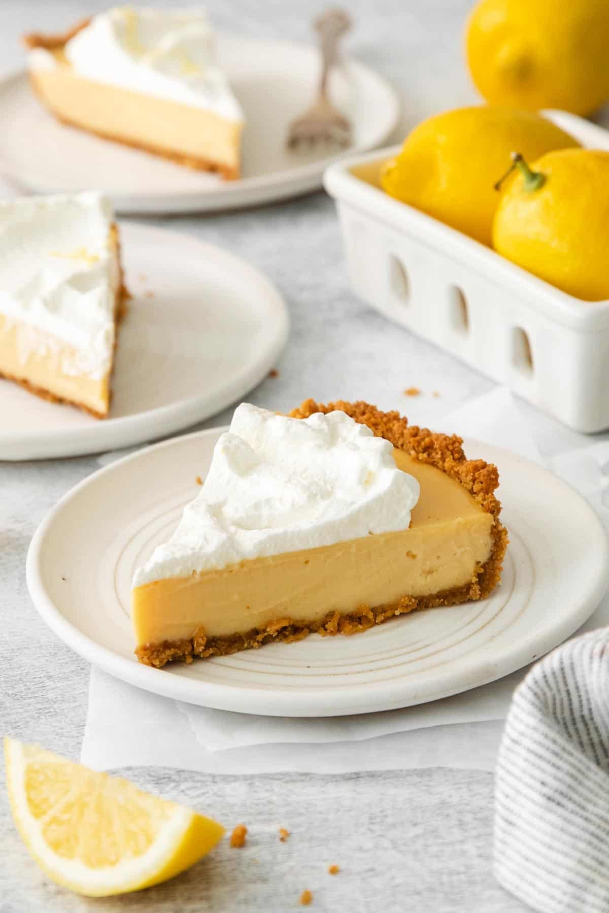 A slice of lemon cream pie on a plate