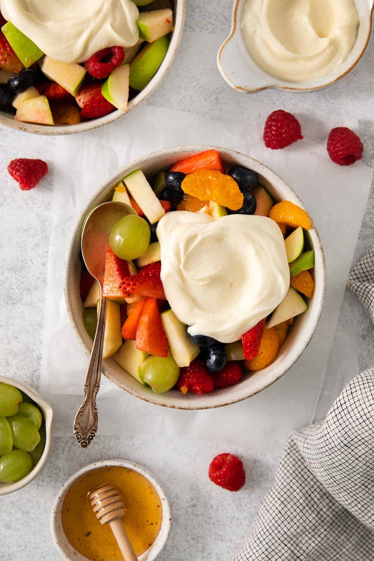 Easter fruit salad in a bowl with honey mascarpone on top