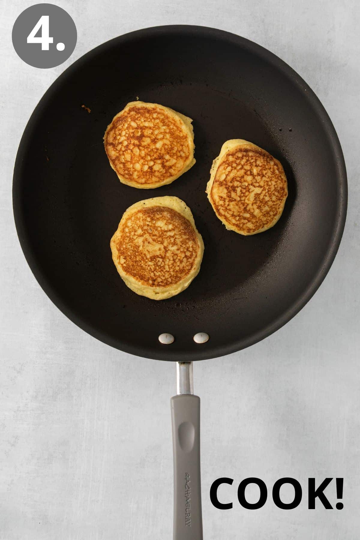 Cornmeal pancakes cooking in a skillet
