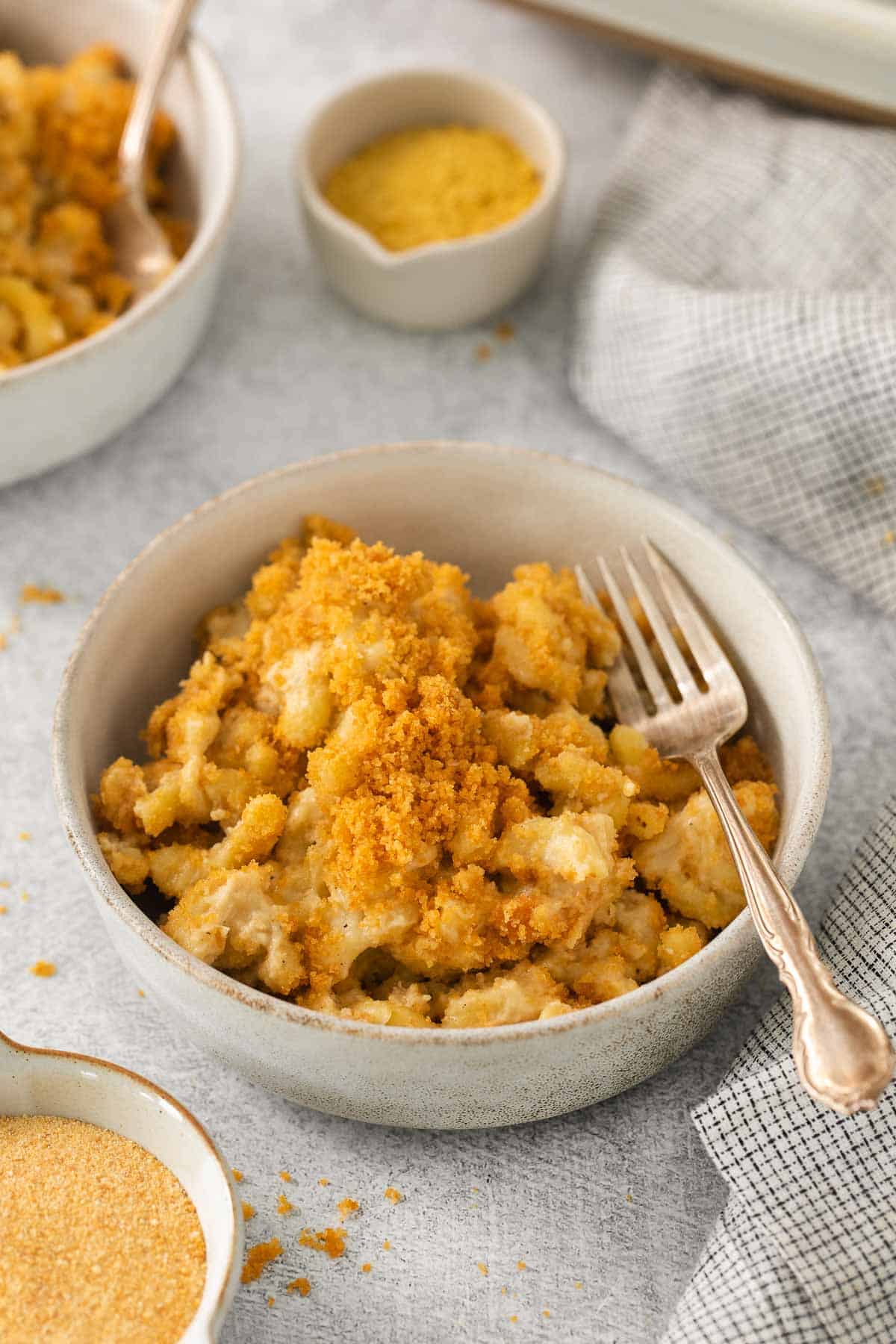 Dairy-free mac and cheese in a bowl with a fork