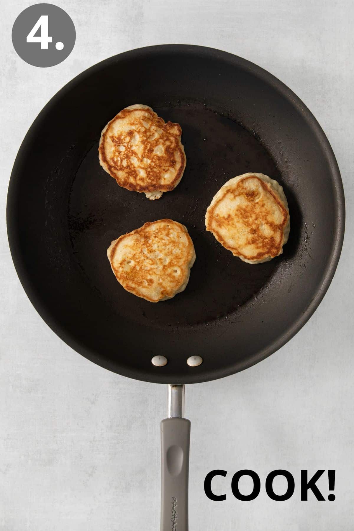 Gluten-free banana pancakes cooking in a skillet