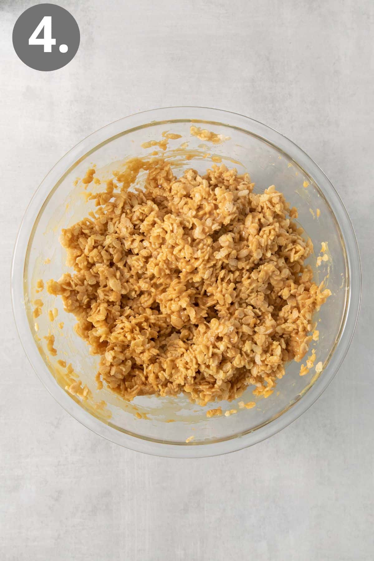 Corn syrup mixture and crispy rice mixed in a bowl