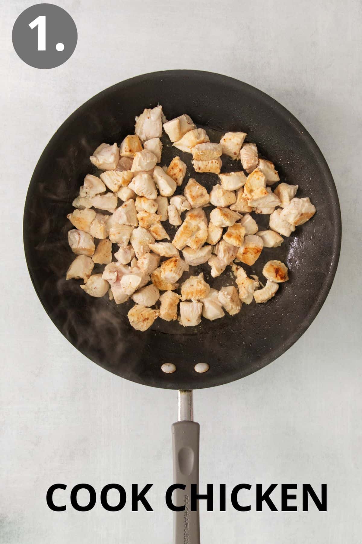 Pieces of chicken cooking in a skillet