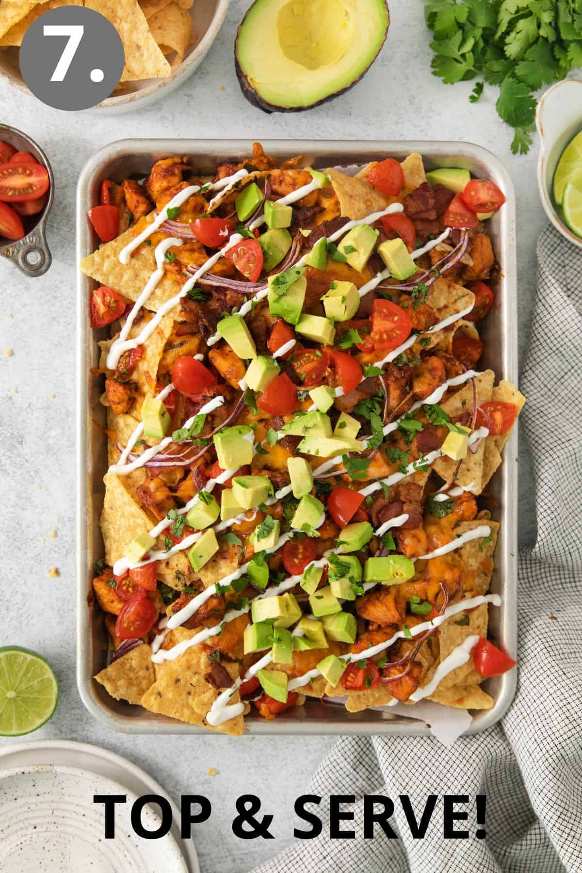 BBQ nachos with toppings on a sheet pan
