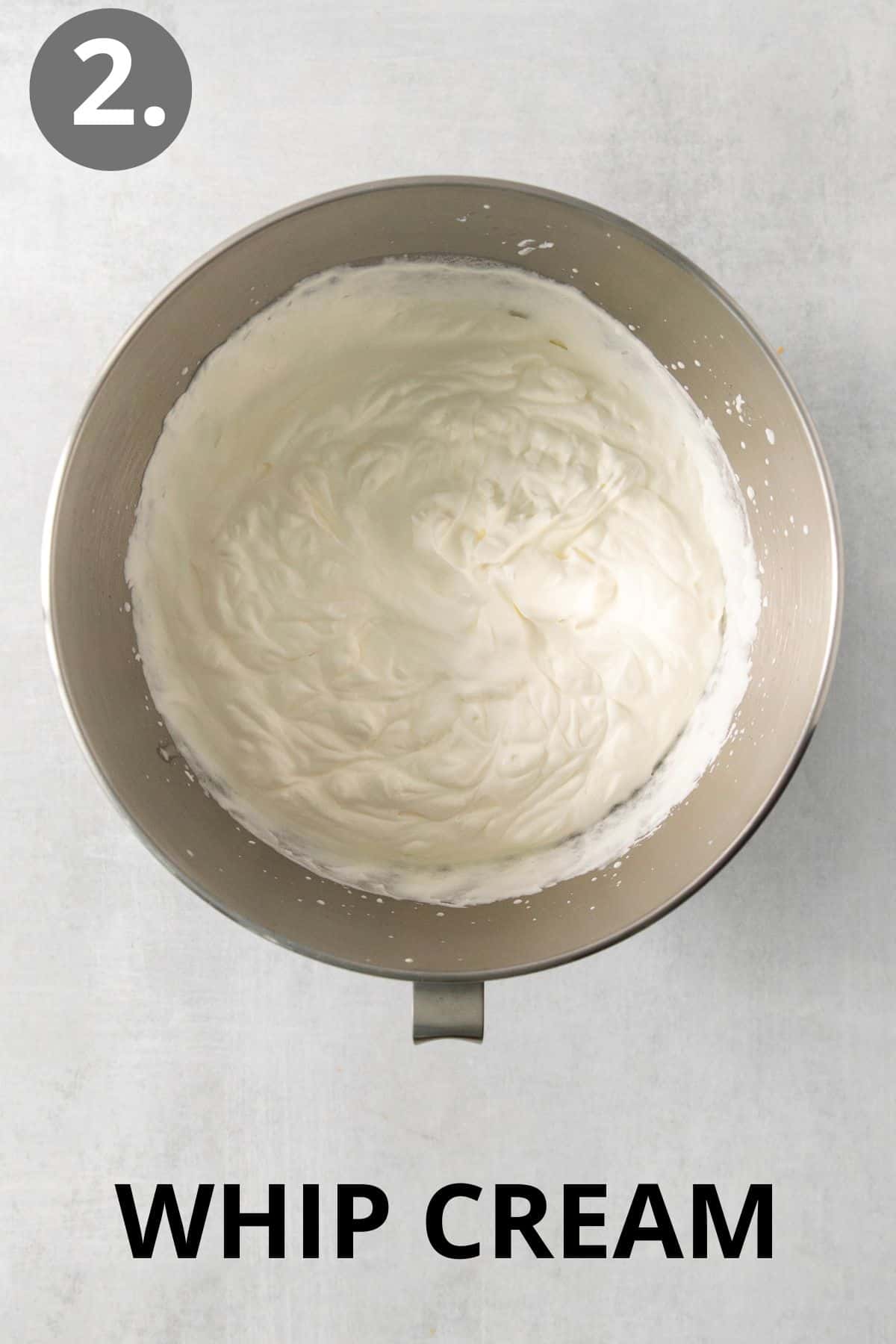 Whipped cream in a mixing bowl