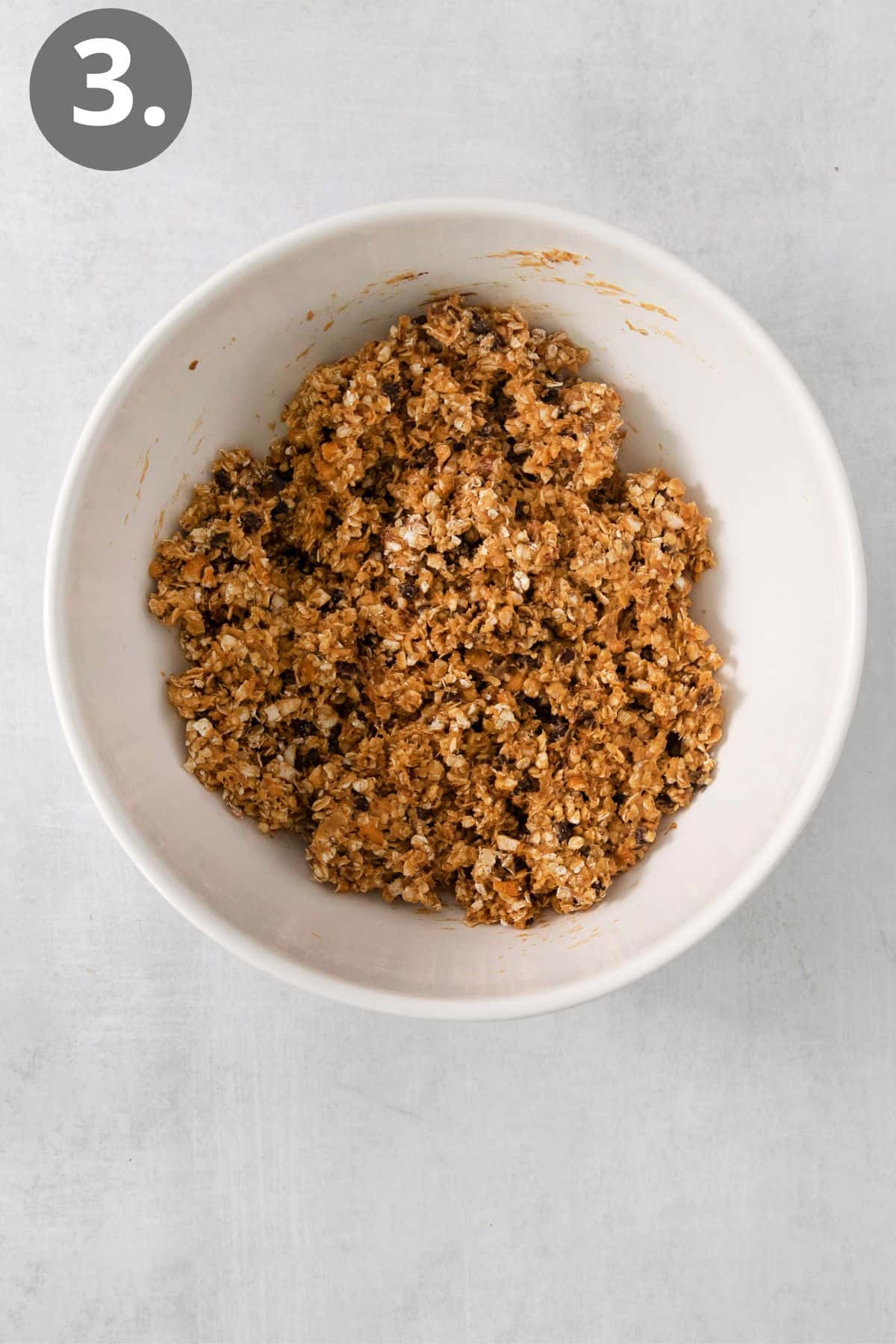 Oatmeal bar ingredients mixed together in a bowl