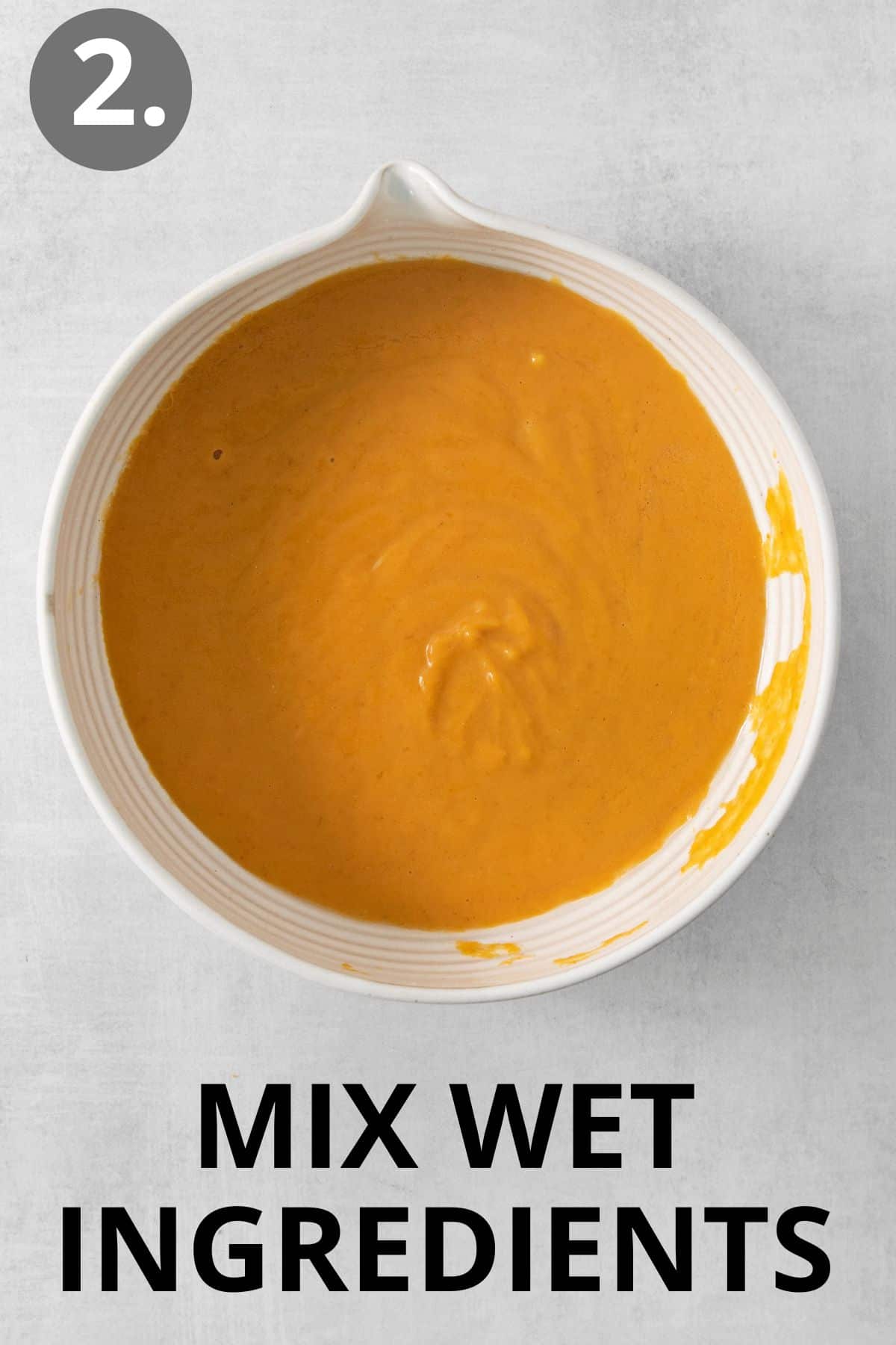 Wet ingredients for gluten-free pumpkin bread in a bowl