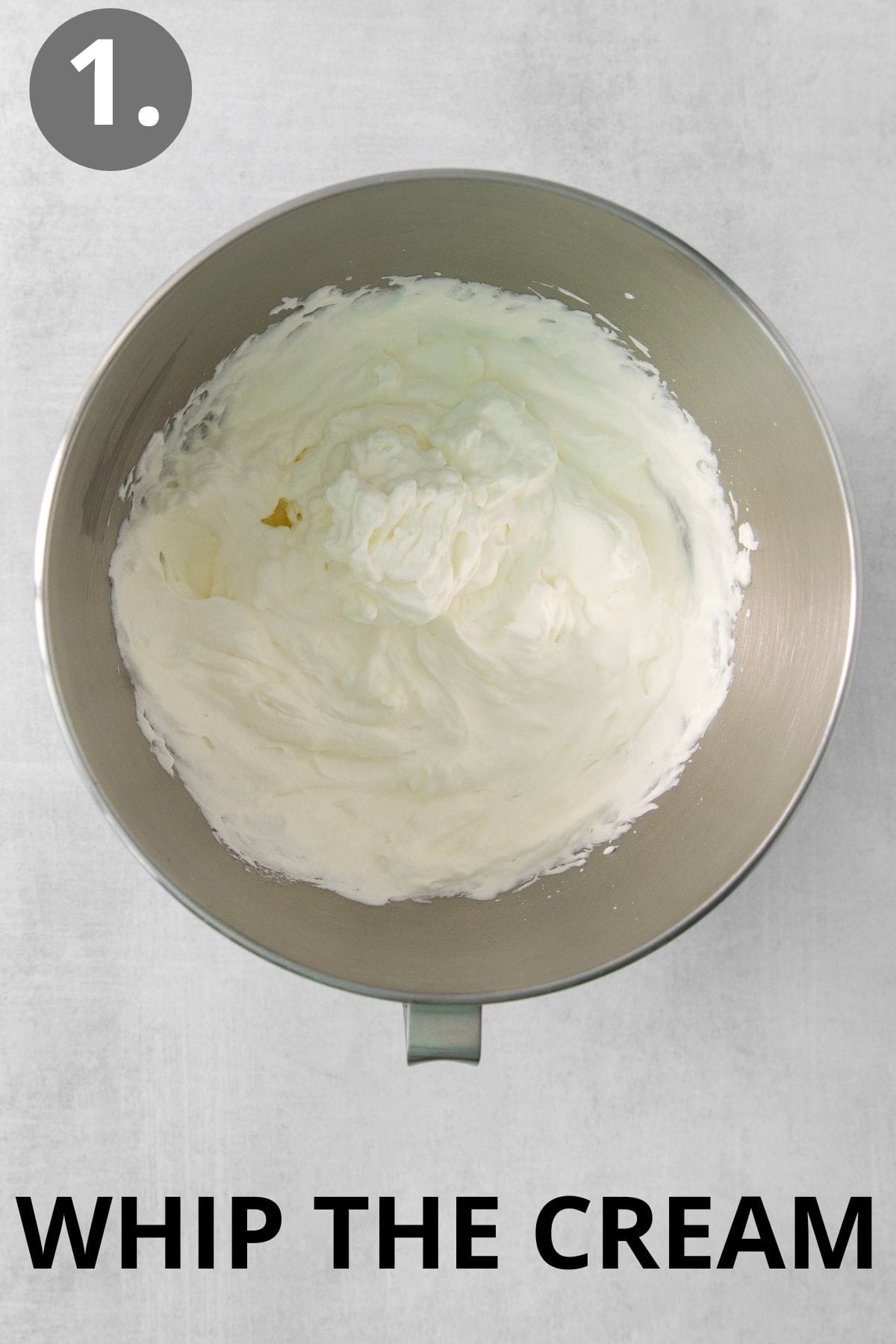 Cream whipped in the bowl of a standing mixer