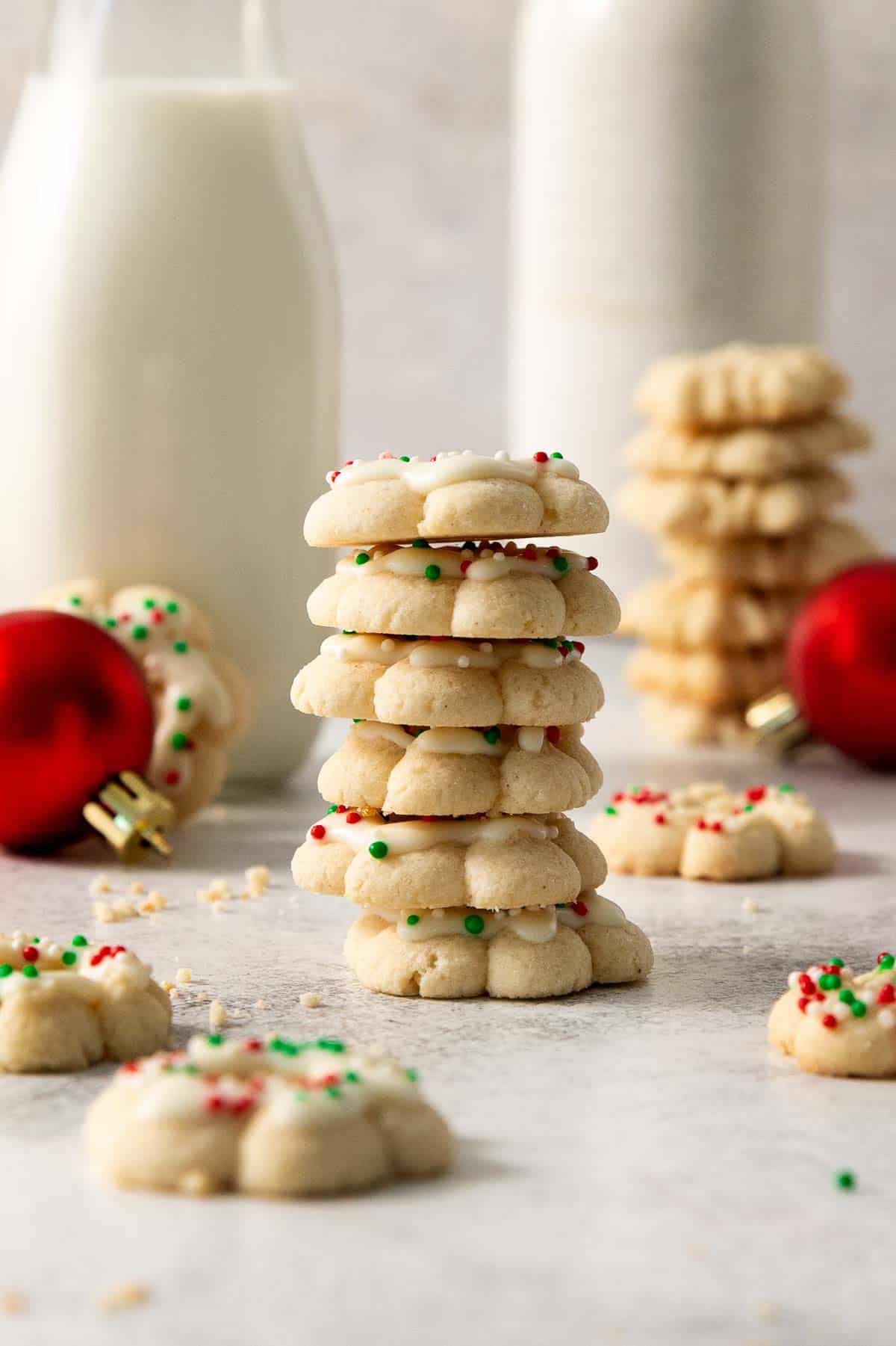 gluten-free spritz cookies stacked on a countertop