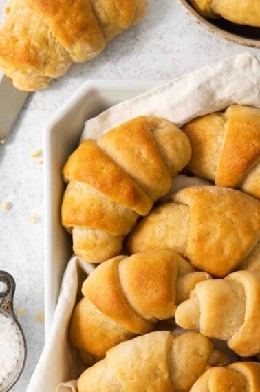 gluten-free crescent rolls in a bowl with a towel