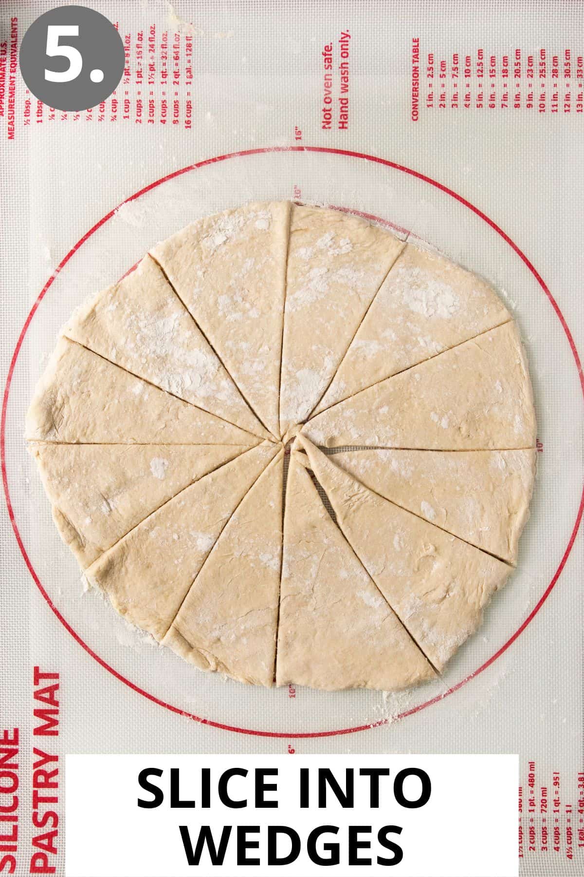 gluten-free crescent rolls dough on a baking mat, sliced into triangles