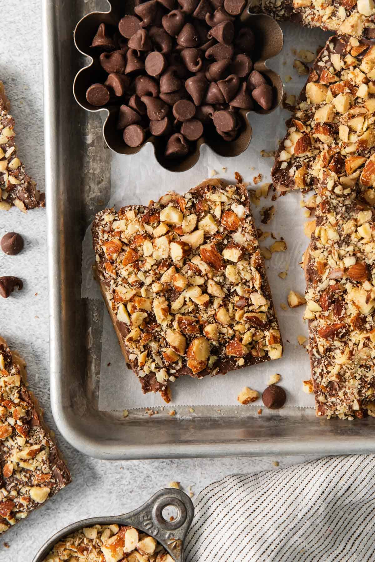 English toffee in a baking sheet with parchment paper