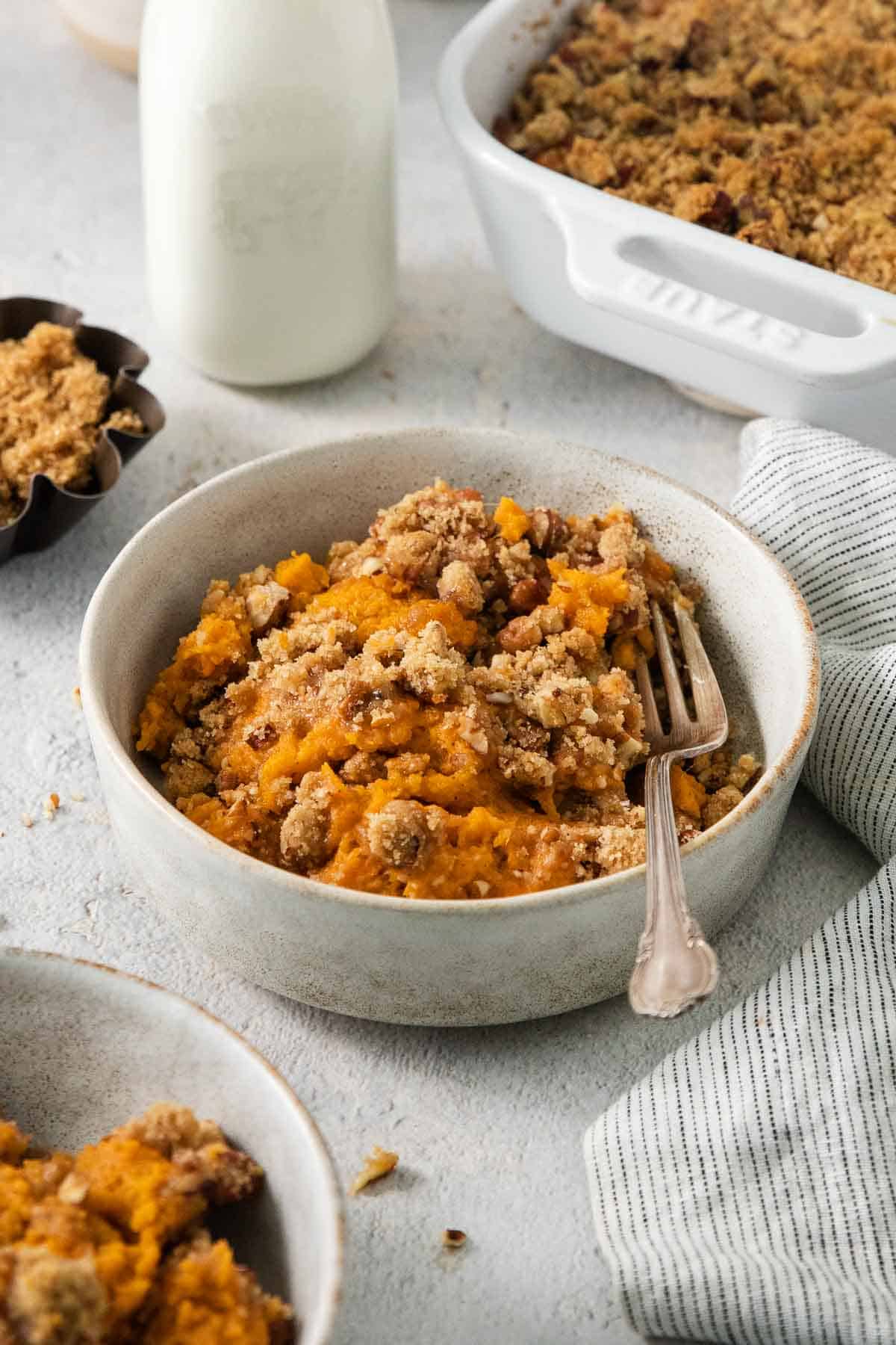 gluten free sweet potato casserole in bowl with fork