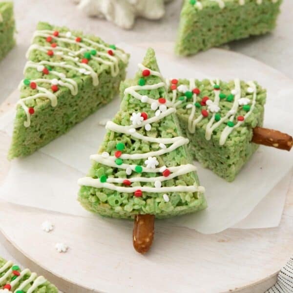Christmas tree crispy treats on a white platter.