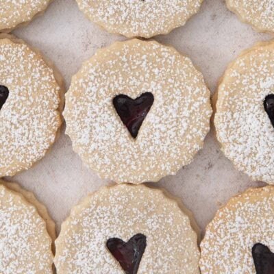 jam-filled linzer cookies with little hearts cut out from the center.