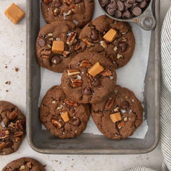 chocolate turtle cookies in a baking pan.