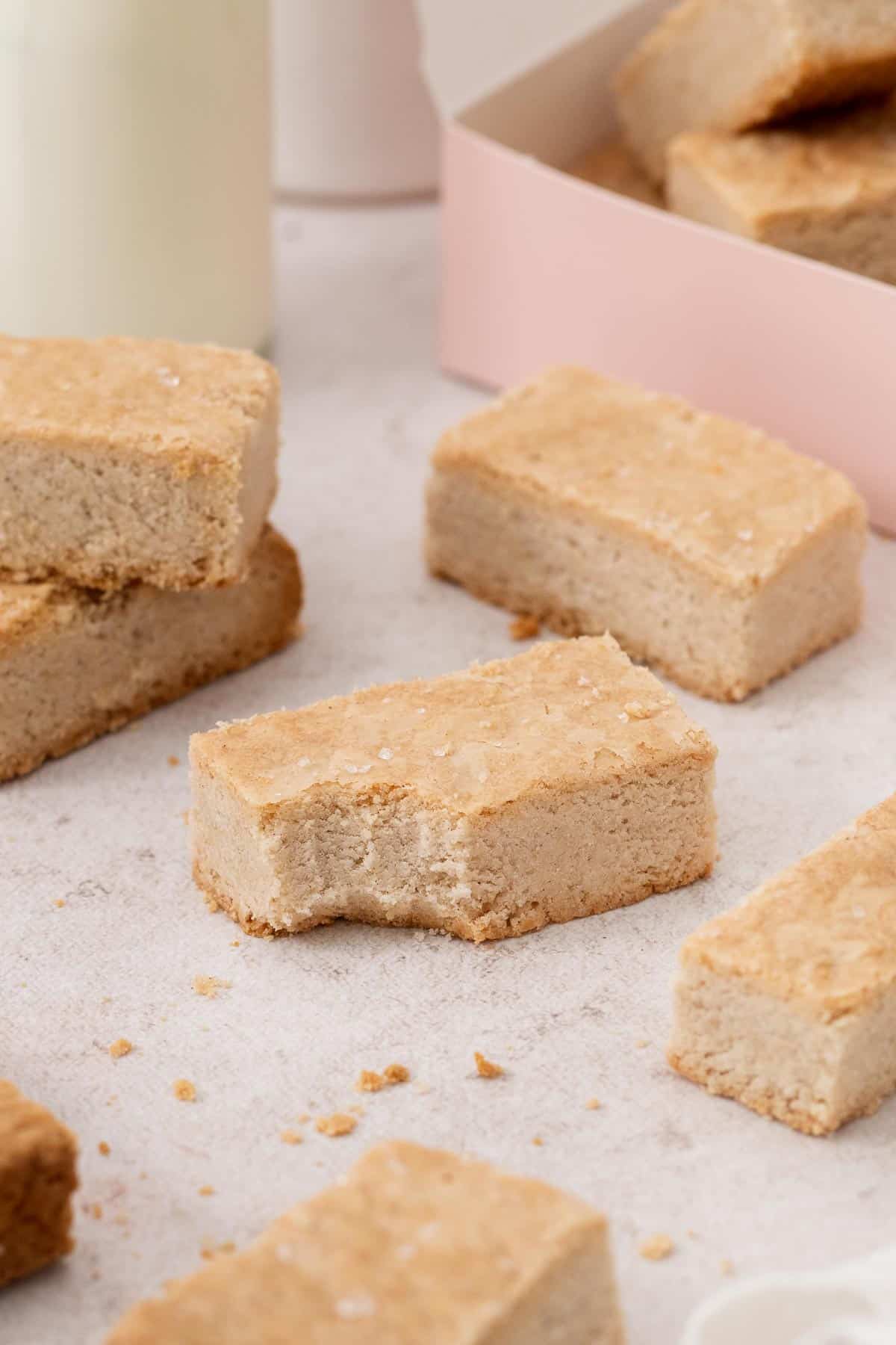 slices of shortbread on the counter with a bite missing from one.