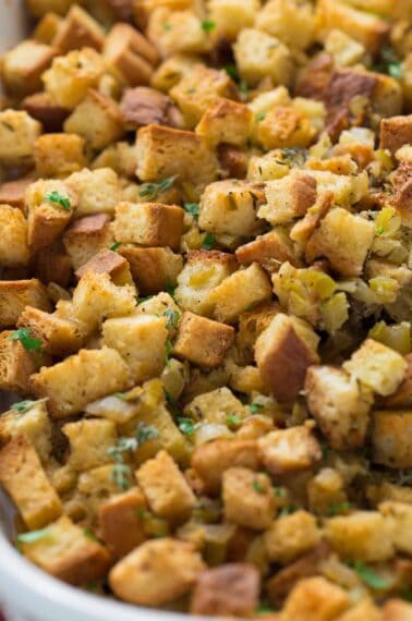 up-close of stuffing in a baking dish.